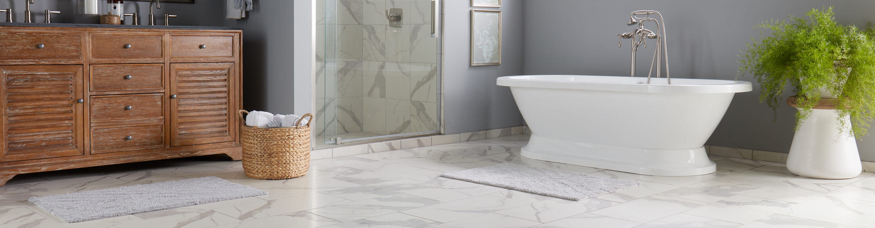 Stone look tile flooring marble floors in bathroom with soaker tub and walk-in shower